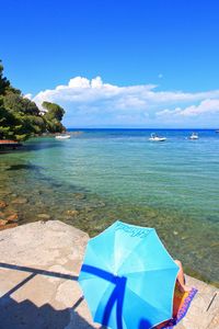 Scenic view of sea against blue sky