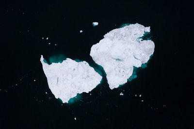 High angle view of snow on black background