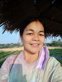 Portrait of smiling woman on field