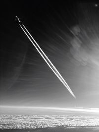 Low angle view of vapor trails in sky