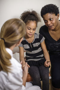 Doctor talking with patient