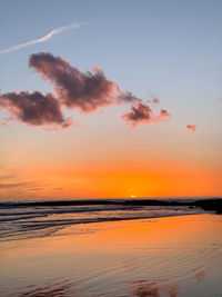 Scenic view of sea against romantic sky at sunset