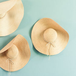 High angle view of hat on wood against white background