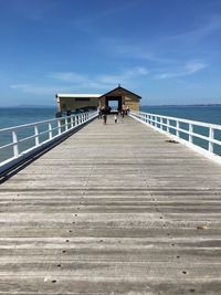 Pier over sea against sky