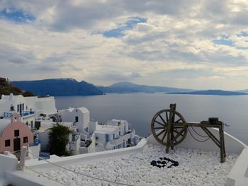 Spinning wheel on building terrace at santorini