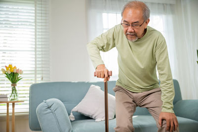 Portrait of senior man working at home