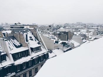 High angle view of buildings in city against clear sky