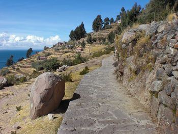 Scenic view of sea and mountains against sky