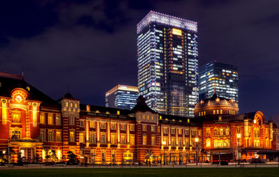 Illuminated buildings in city at night