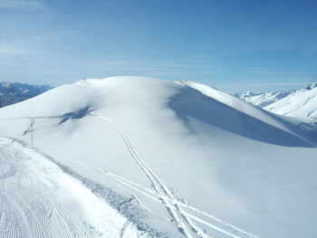 Snow covered mountain against sky