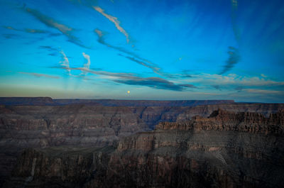 Scenic view of landscape against blue sky