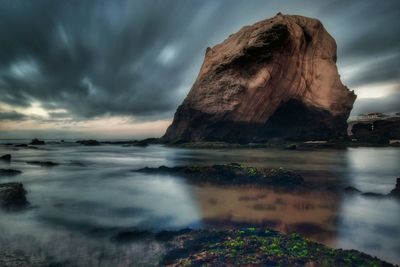 Rock formation in sea at penedo do guincho