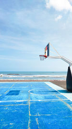 Scenic view of a dreamy basketball court by the beach and seaside.