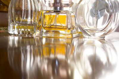 Close-up of perfumes on table