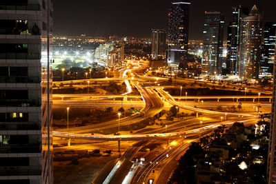 Dubai, uae, november 2019 night view of a road junction with moving cars against the lights