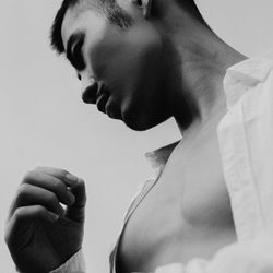 Close-up of young woman over white background