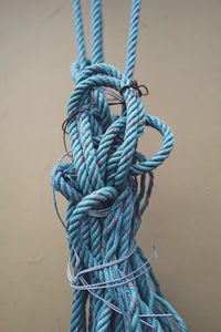 Close-up of rope tied on wood