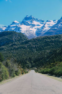 Scenic view of snowcapped mountain against clear blue sky