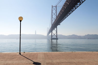 Bridge over sea against sky