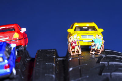 Close-up of toy car against blue sky