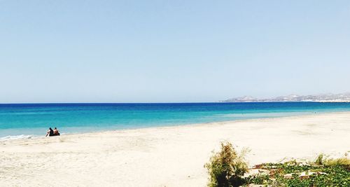 Scenic view of beach against clear sky