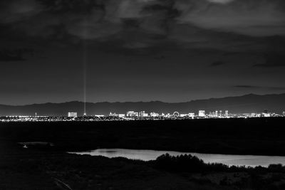 Scenic view of illuminated mountains against sky at night