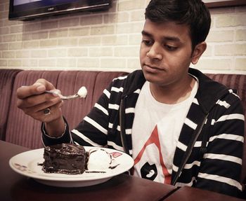 Close-up of man eating food