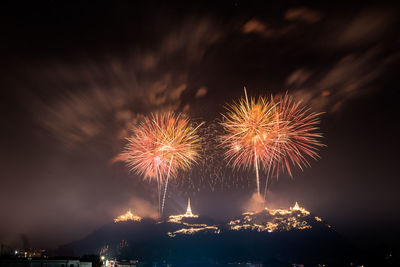 Firework display at night