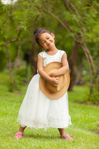 Happy woman standing on field