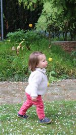 Cute girl standing on grass