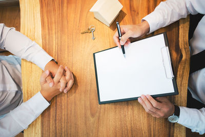 High angle view of people on table