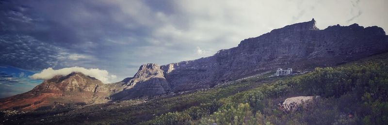 Scenic low angle view of table mountain against cloudy sky