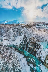 Scenic view of snowcapped mountains against sky during winter