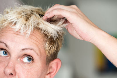 Close-up of confused blond woman