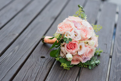 High angle view of white and pink  rose bouquet for bride, wedding day decor, bridal bouquet