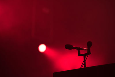 Microphone in red stage lights