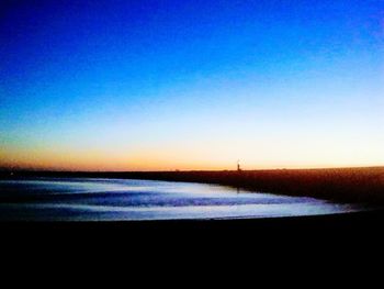 Scenic view of sea against blue sky