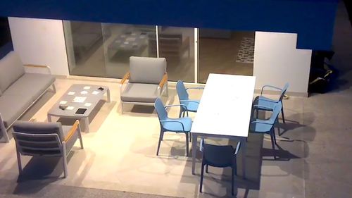 High angle view of empty chairs and table in restaurant