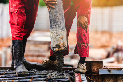 Low section of people working at temple