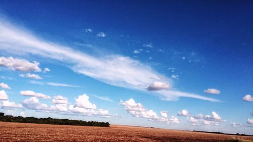 Scenic view of landscape against blue sky