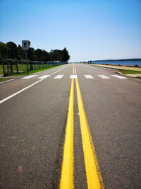 View of road sign against clear sky