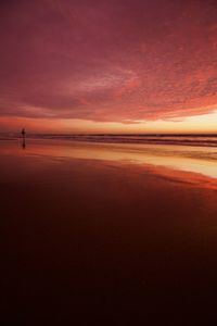 Scenic view of beach against sky during sunset
