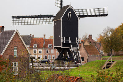 Traditional windmill against sky