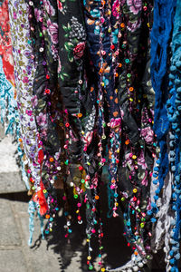 Close-up of multi colored hanging for sale in market