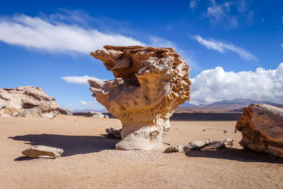 View of rock formations in desert against sky