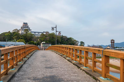 Karatsu castle from jyounai bridge in city at sunset, saga, japan. seaside castle as dancing crane.