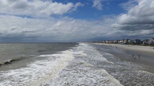 Scenic view of sea against cloudy sky