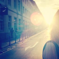 People walking on road during sunset