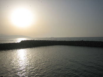 Scenic view of sea against clear sky during sunset