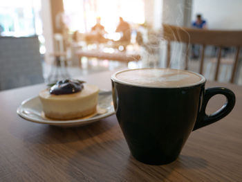 Close-up of coffee served on table